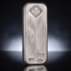 Johnson Matthey 100 oz silver bar standing upright, front with the diamond-shaped JM stamp, straight on