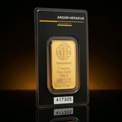 Argor-Heraeus KineBar gold bar in its black assay card, front, turned to a side angle