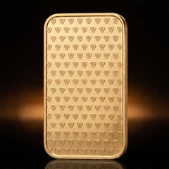 Back of the Metalor 1 oz gold bar on its own, a staggered pattern of small triangular hallmarks
