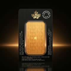 Back of the black Royal Canadian Mint assay card with the assay certificate text and signature, and the back of the 1 oz gold bar